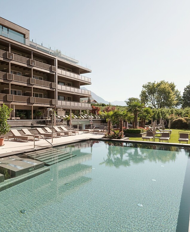Hotel with thermal pool, garden, and sun loungers