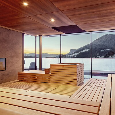 Panoramic sauna in winter with snow-covered mountains