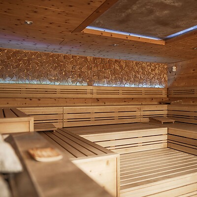 Panoramic sauna with view of mountains and valley
