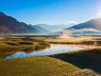 Golf course in morning light in the Alps