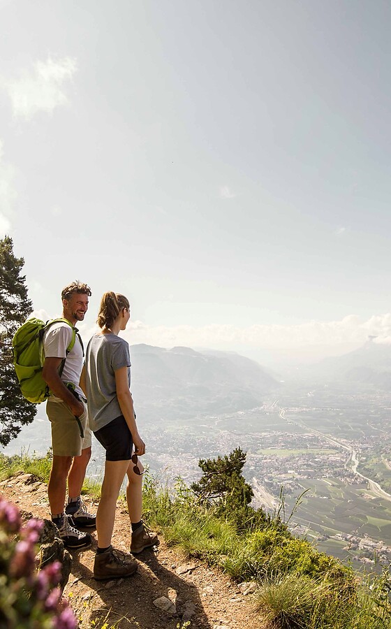 Woman and man on a spring hike in the mountains