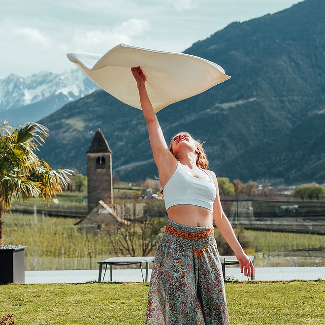 Sauna master waving a towel