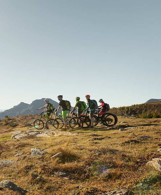 Group of cyclists mountain biking in the mountains