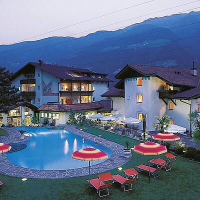 Hotel Lindenhof with the outdoor pool and sun loungers in the past