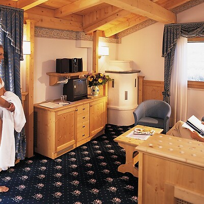 Woman and man in a hotel room at Preidlhof in the past