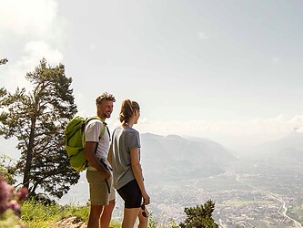 Woman and man on a spring hike in the mountains